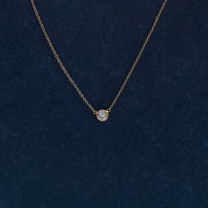 Tiffany & Co. single diamond pendant.